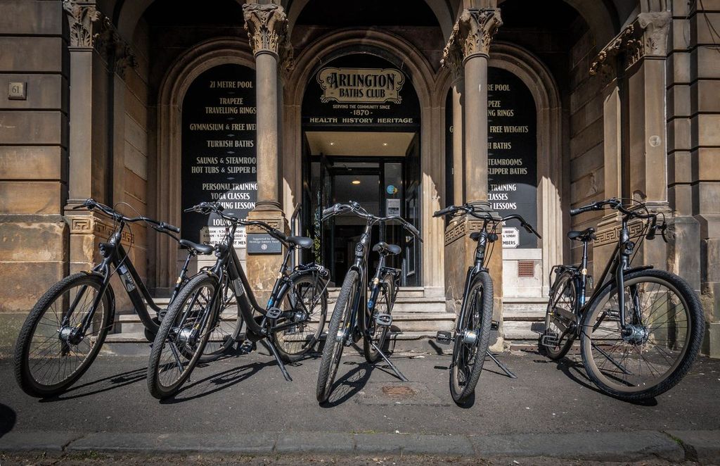 bicycles in front of historic baths building